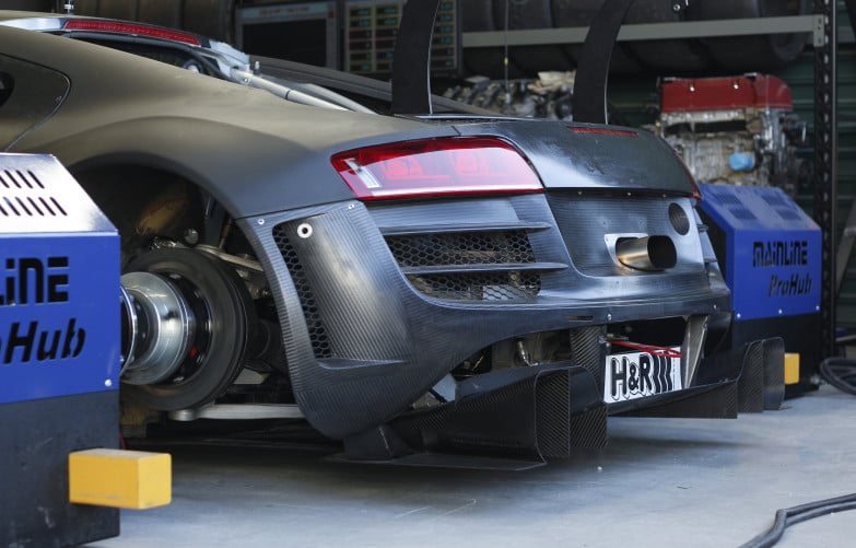 Performance car being ECU tuned on a chassis dyno
