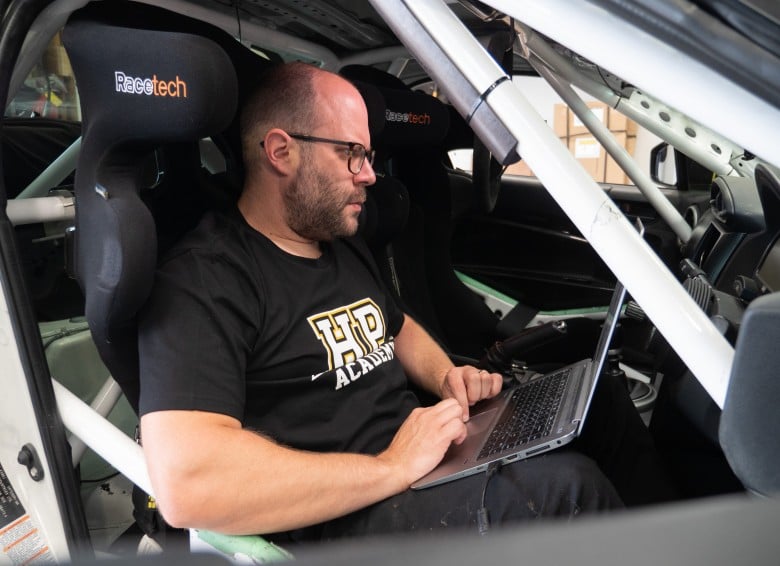 What is CAN Bus20 driver seated in race car programming a CAN bus device via laptop