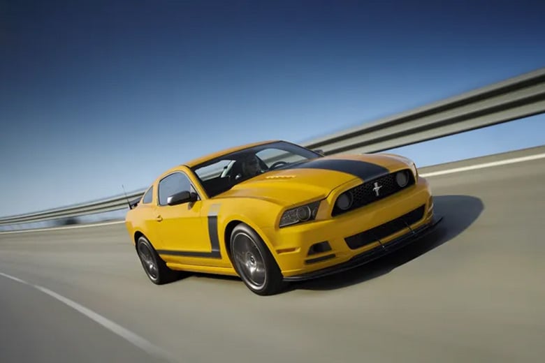 2013 Ford Mustang Boss 302 front three-quarter driving shot