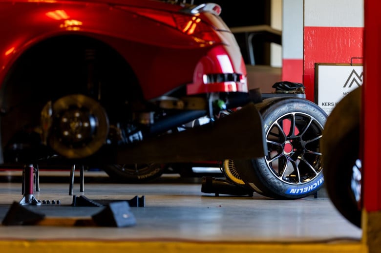Nissan race car rear diffuser in pit garage