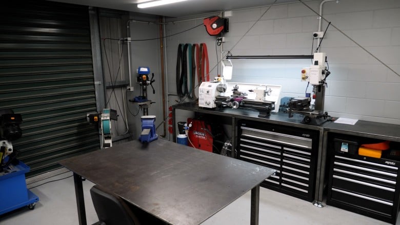 MIG welding workshop setup showing equipment and workbench