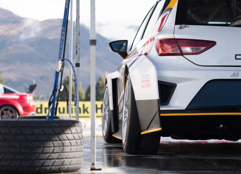 Student completing an online motorsport tuning course on a laptop