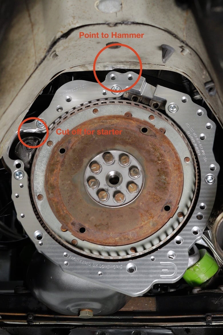 Volvo Redblock engine and adapter plate with the transmission tunnel interference point marked.