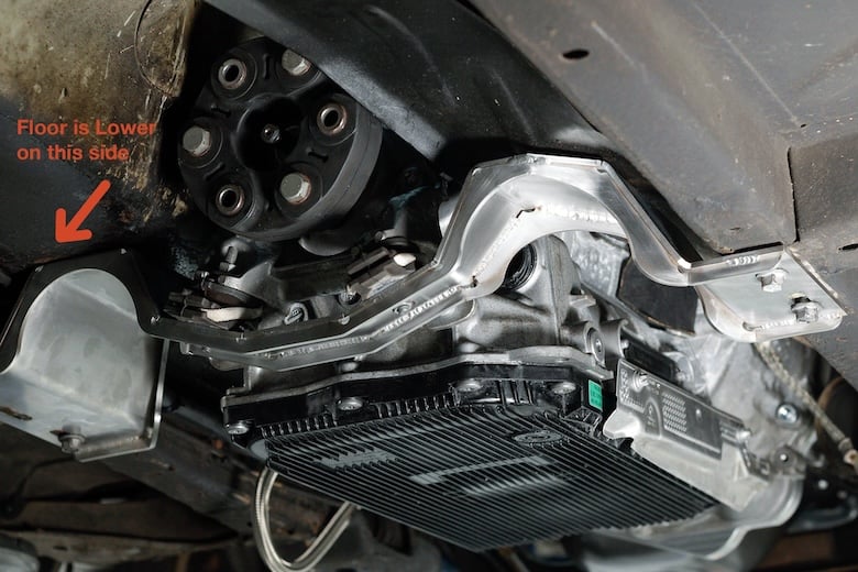 Custom stainless steel ZF 8HP gearbox crossmember with the Volvo floor clearance area marked.