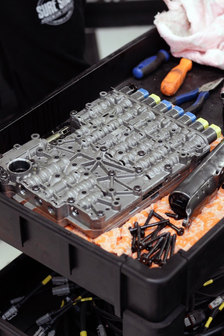 ZF 8HP valve body on the workbench during TurboLamik control board installation.