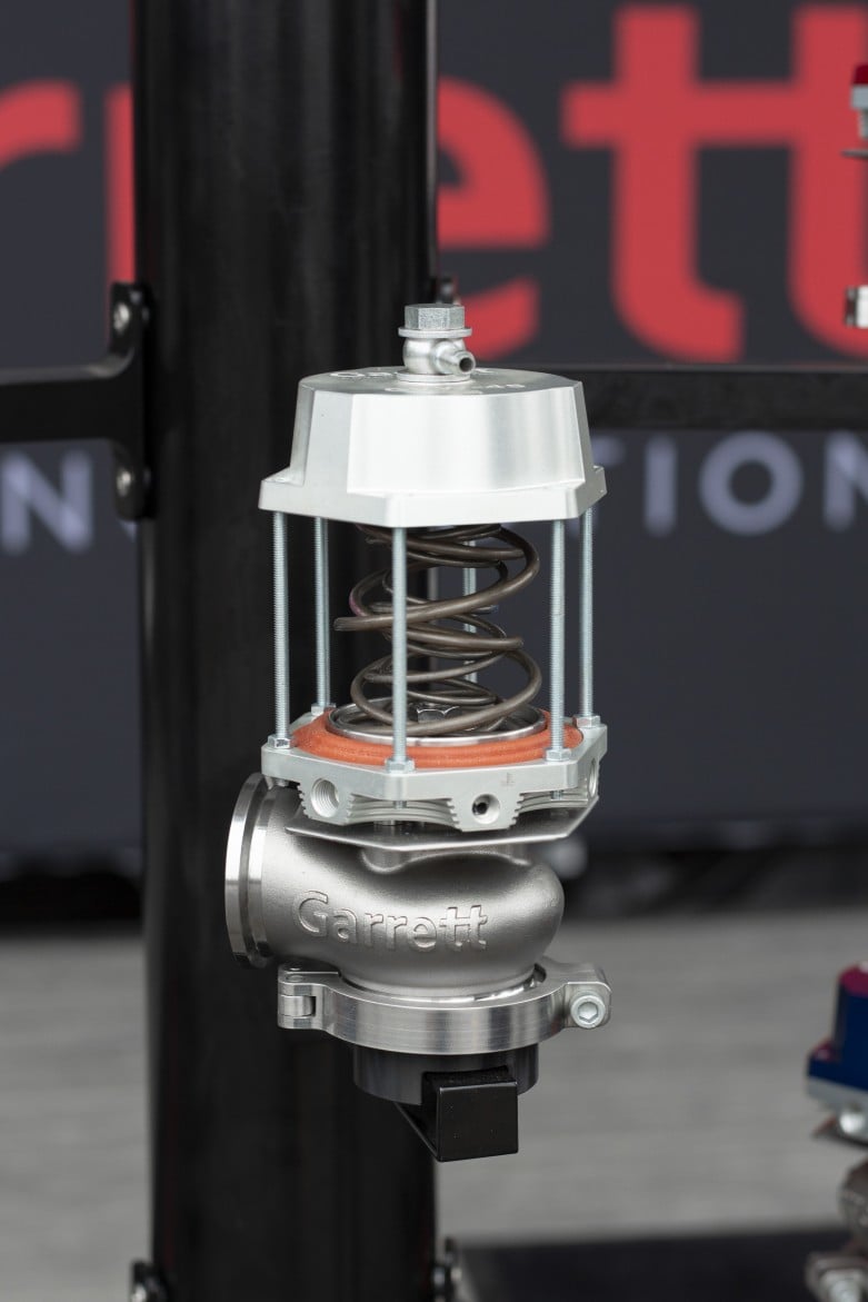 Garrett wastegate cutaway showing internal spring and diaphragm assembly