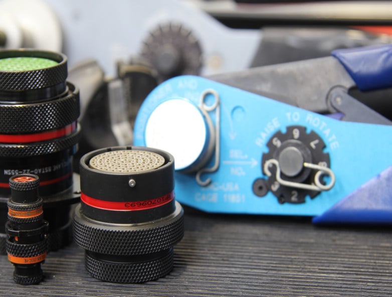 DMC AFM8 crimp tool on workbench