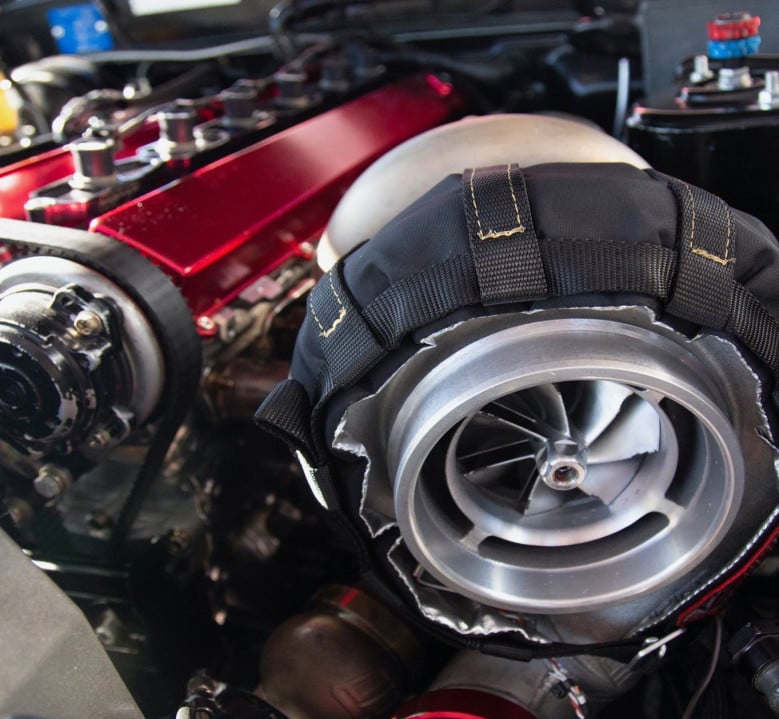 Engine air intake without an air filter, illustrating how airflow affects petrol engine torque.