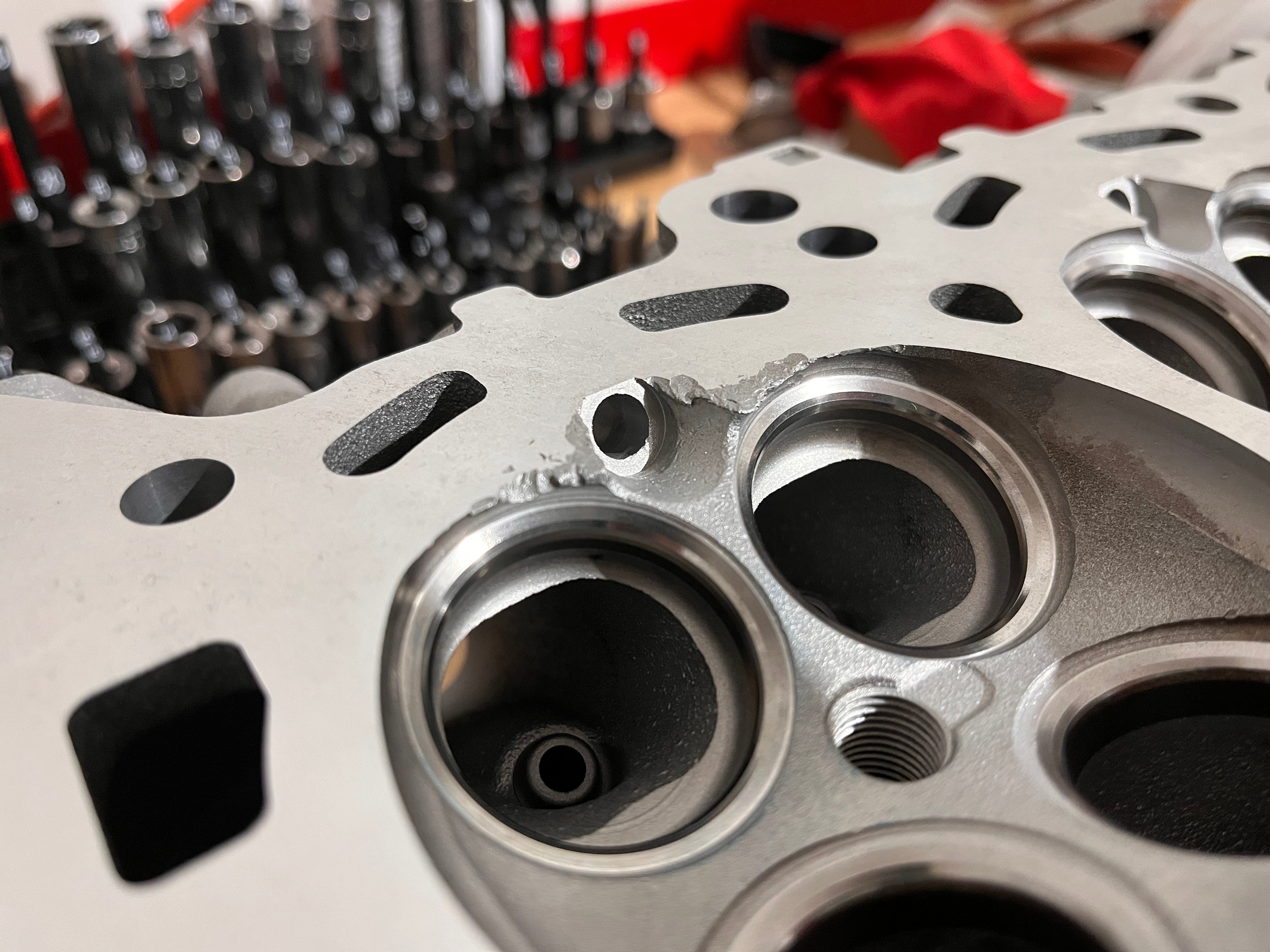 Machined head, remnants of damage
